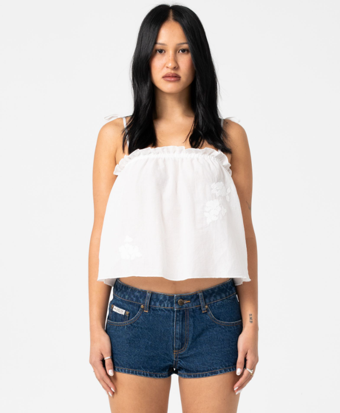 Rusty Feyre Cami Top in white on dark-haired woman from front