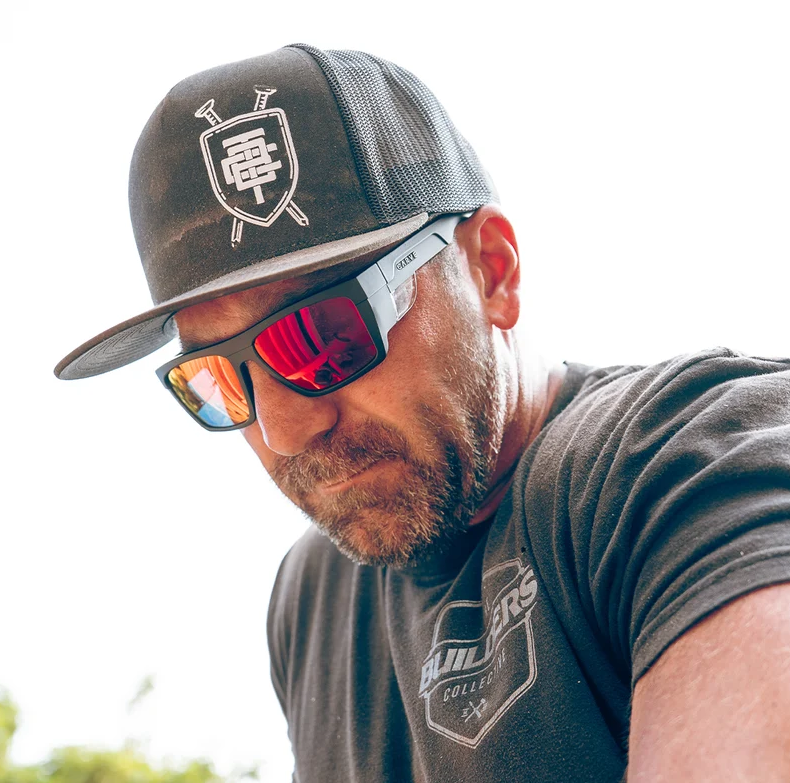 Carve Volley Matte Black/Red Iridium Polar Safety Sunglasses on model's face