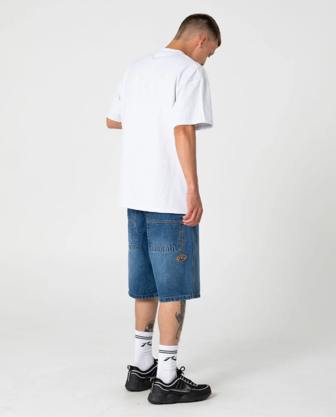 Rusty Larry 22" Men's Denim Shorts in blasted middy blue colourway on model in white rusty tee from the back