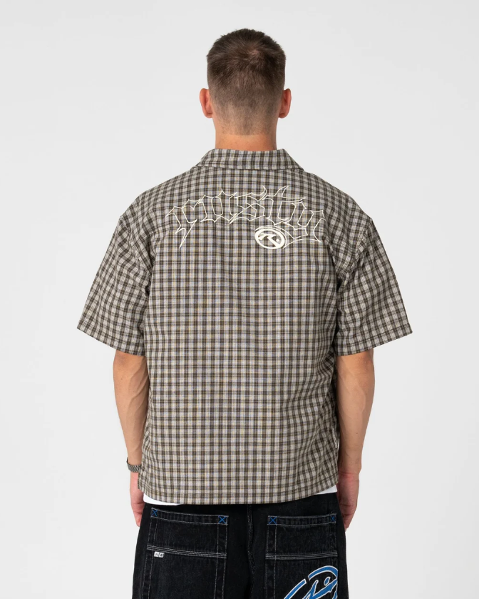 Rusty Anarchy Short Sleeve Shirt in savannah colourway on model from the back showing bold Rusty branding