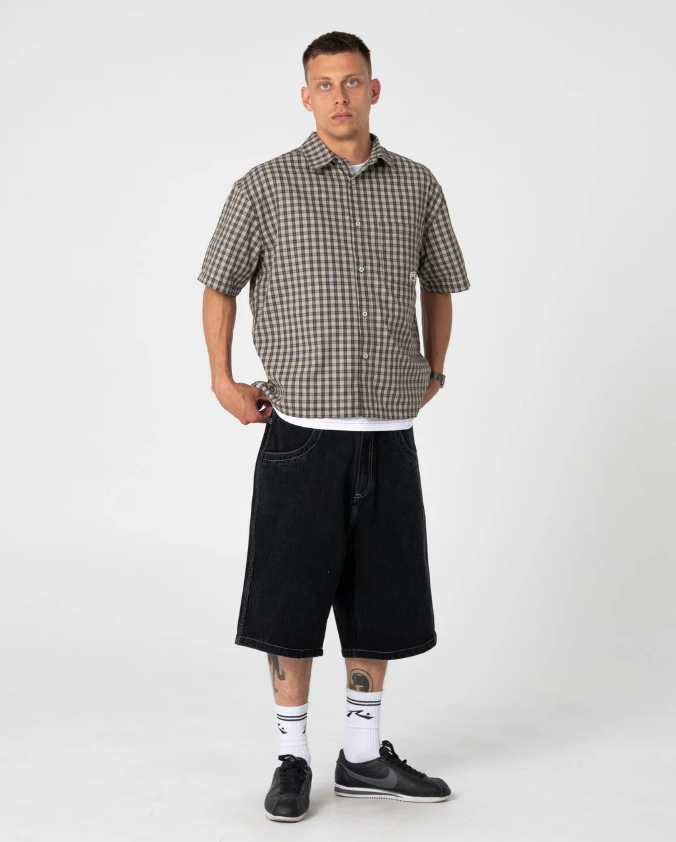 Rusty Anarchy Short Sleeve Shirt in savannah colourway on model in black denim shorts from the front done up