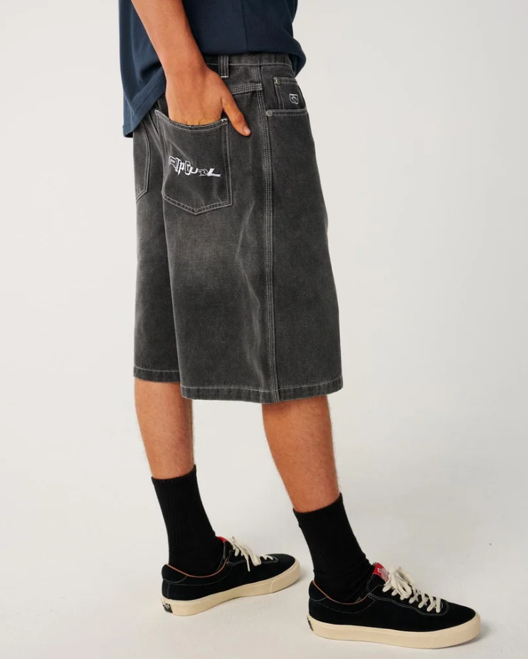 Rip Curl Archine 23" Dirty Denim Shorts in washed grey from rear showing embroidered pocket