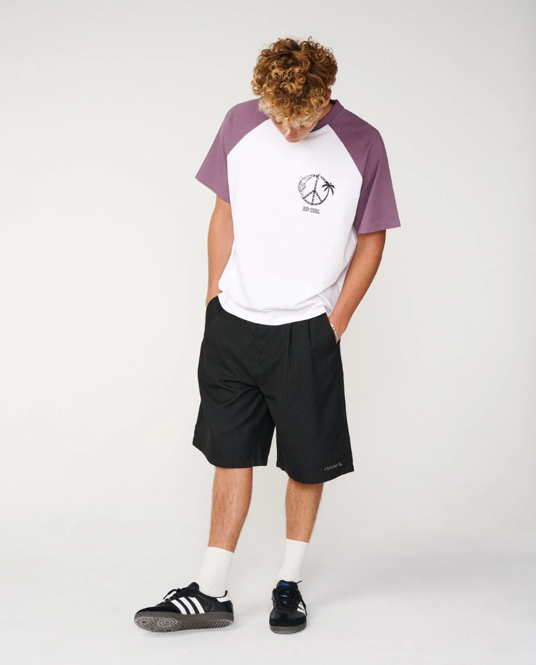 Rip Curl Archive TWU Pinny 23" Walkshorts in black pinstripe on model in white and purple tee