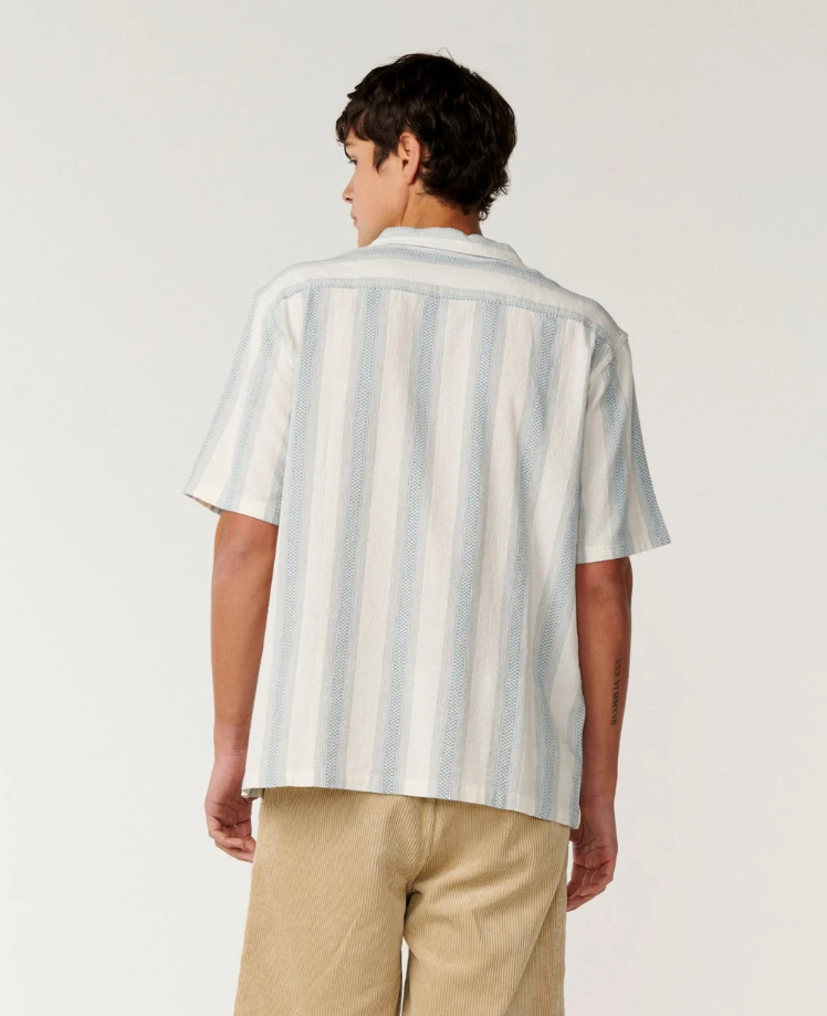 Rip Curl Classic Surf Weaver Short Sleeve Shirt in bone colourway with light blue vertical stripes from the back
