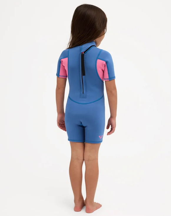 Roxy Prologue 2mm Girls Toddler Wetsuit in dutch blue colourway with pink panels on model from the back