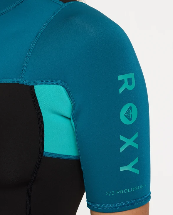 Roxy Prologue 2mm Spring Womens Wetsuit in baltic colourway with black body on model from the side showing shoulder close up