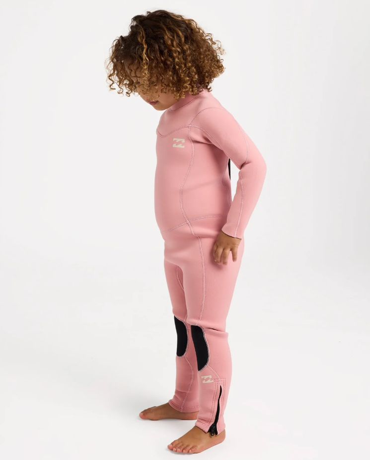 Billabong Absolute 3/2mm Flatlocked Girls Toddler Wetsuit in french rose pink colourway on a model from the side