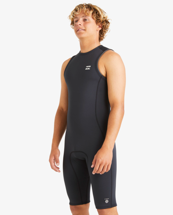 Billabong Absolute 2mm Short John Wetsuit in black on model from the side