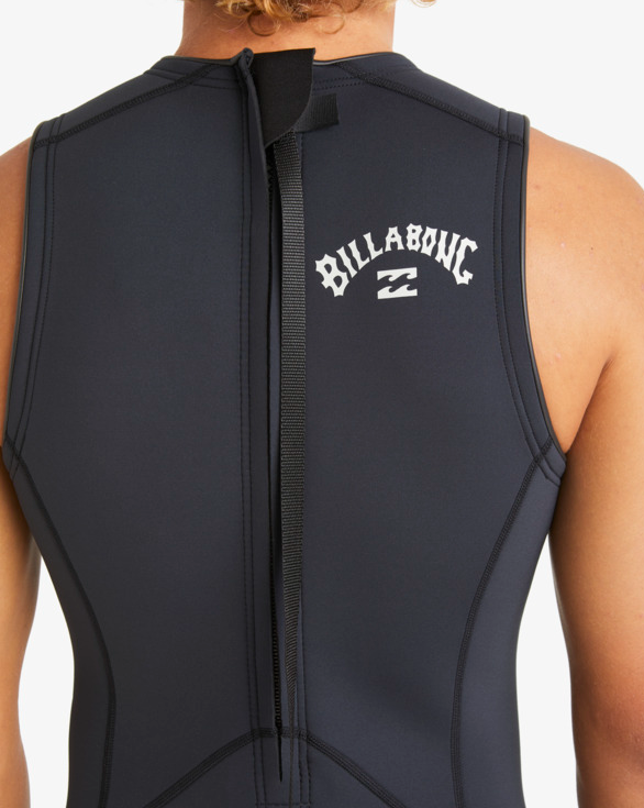 Billabong Absolute 2mm Short John Wetsuit in black on model from the back close up of the zip