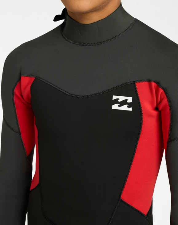 Billabong Absolute 3/2mm Flatlocked Boys Wetsuit in black, grey and red on model from the front close up