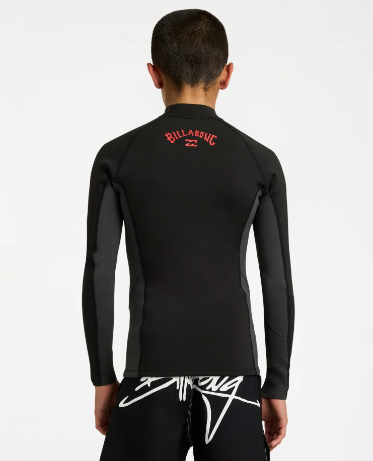 Billabong Absolute 1mm Long Sleeve Boys Wetsuit Vest in tar black on model from the back