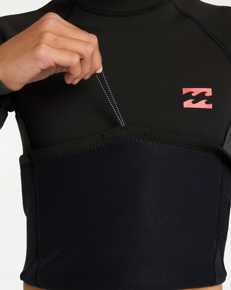 Billabong Absolute 1mm Long Sleeve Boys Wetsuit Vest in tar black on model from the front