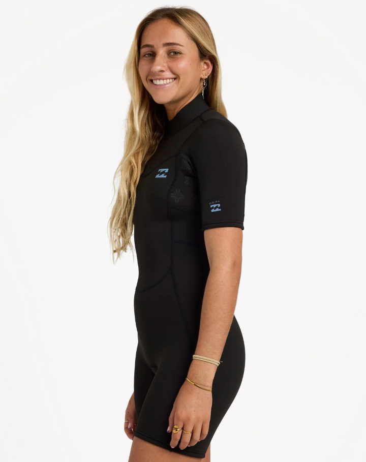 Billabong Absolute Core 2mm Spring Womens Wetsuit in black on model from the side close up