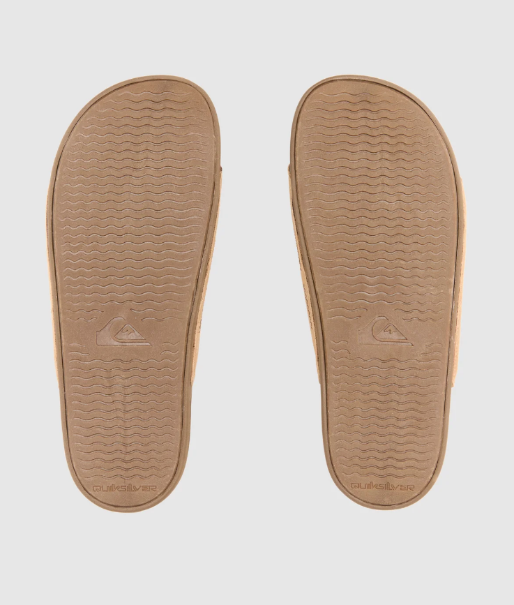 Quiksilver Sunset Suede Slides from the underside of a pair