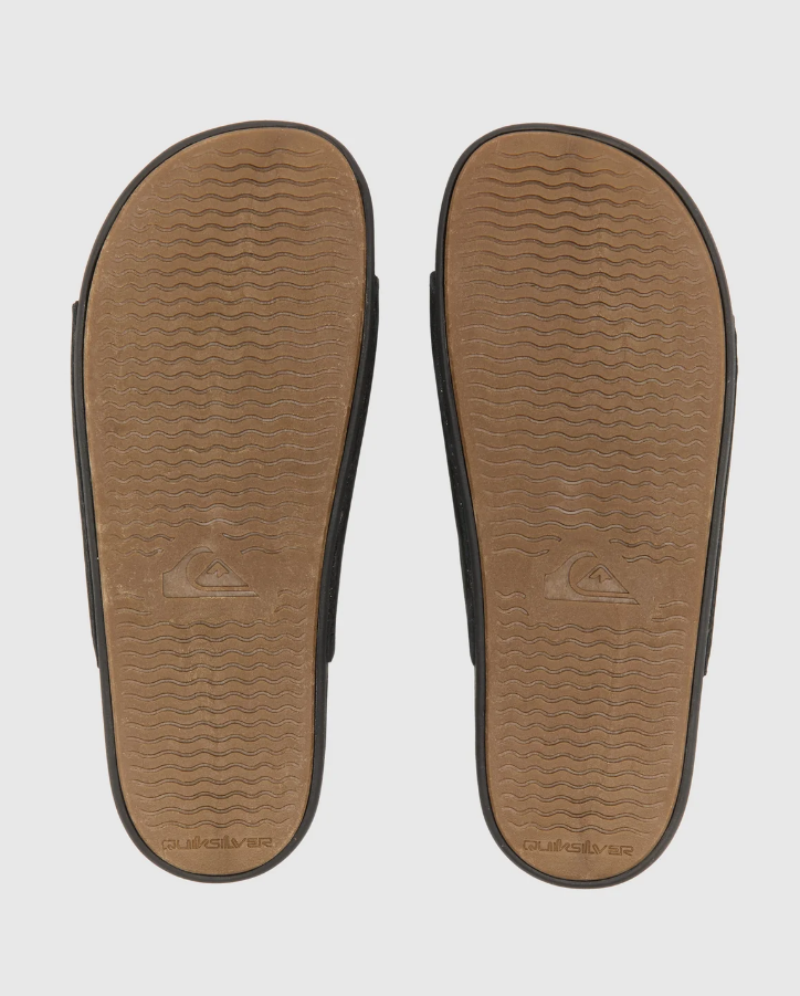 Quiksilver Sunset Nubuck Double Adjustable Slides in black showing the soles of a pair