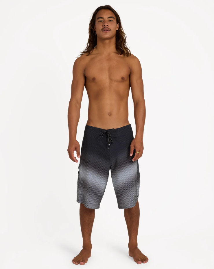 Billabong Fluid Pro 21" Boardshorts in black fade on model from the front
