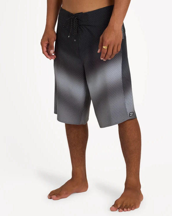 Billabong Fluid Pro 21" Boardshorts in black fade on model from the side close up