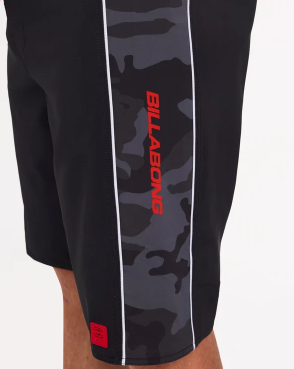 Billabong Adiv Strike Mission DBah 21" Boardshorts in black with camo panels on model from the side close up
