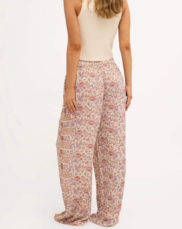 Billabong Forevermore Elastic Waist Pants in multi coloured floral print on blonde model in natural tank from rear view close up