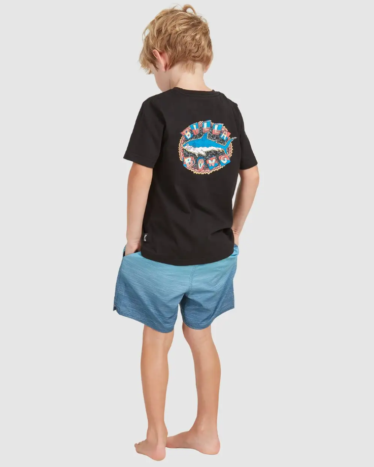 Billabong Groms Sergio Layback Shorts
 in light navy colourway on blond model in black tee from back