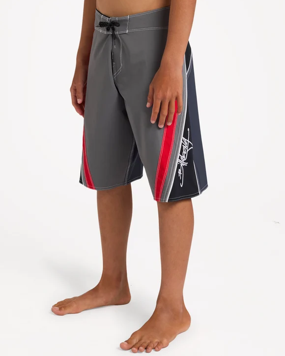 Billabong Boys Fluid 2K 19" Boardshorts in grey with red and black detail on model from the side