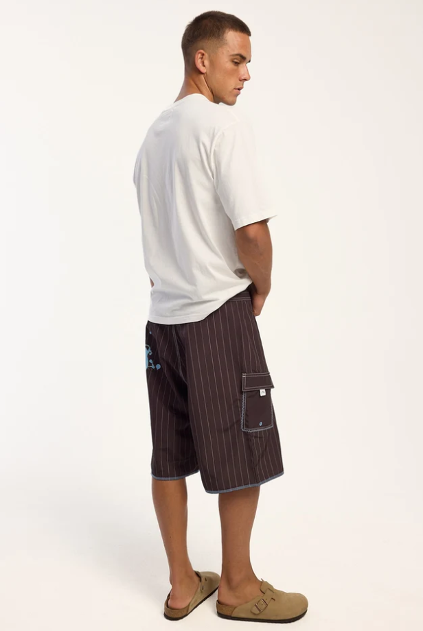 Rusty Scribbla 24" Fixed Waist Boardshorts in java brown with pin stripes on model in white t-shirt from the back