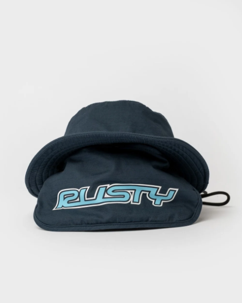 Rusty Carbon Bucket Hat in navy from the rear showing Rusty printed back flap