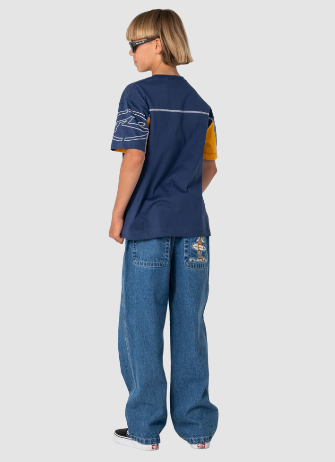Rusty Boys Cyber Short Sleeve Tee in navy on boy in blue jeans from the back full length