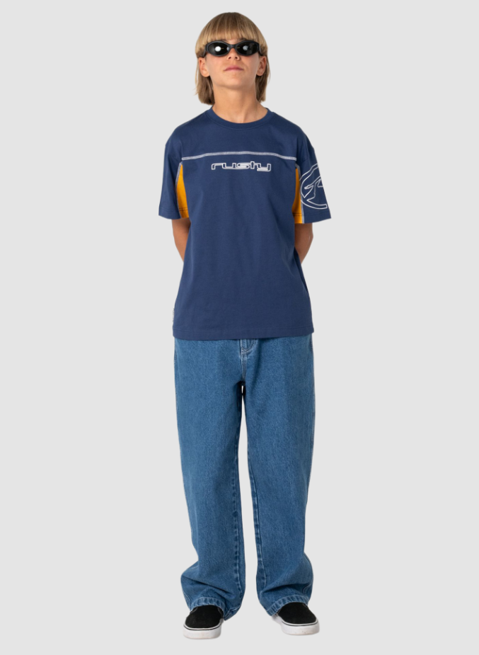 Rusty Boys Cyber Short Sleeve Tee in navy on boy in blue jeans from the front
