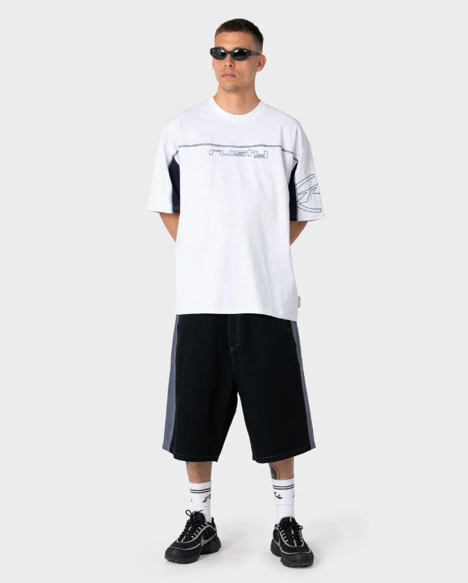 Rusty Cyber Wave Men's T-Shirt in ecru marle on model from the front in black walkshorts