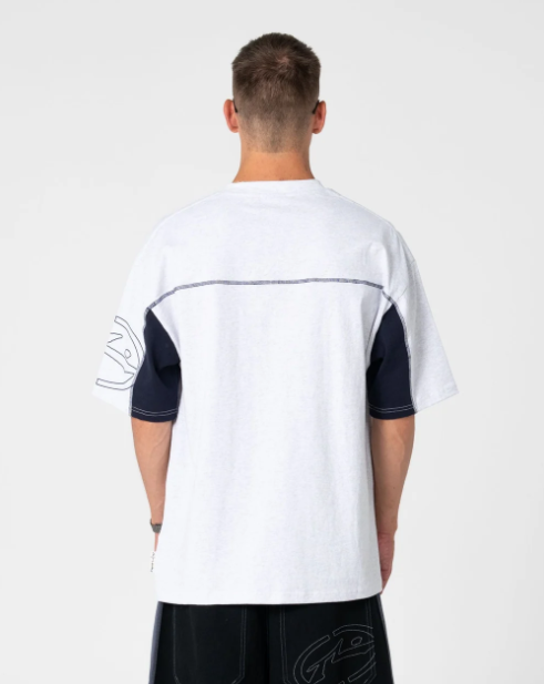 Rusty Cyber Wave Men's T-Shirt in ecru marle on model from the rear in black walkshorts