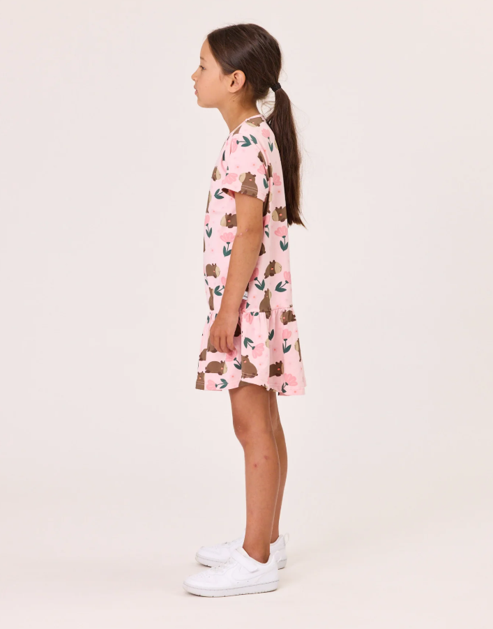 Kissed By Radicool Floral Capybaras Frill Dress in pink on girl from the side