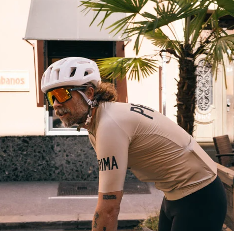 CHPO Brand Henrik Sunglasses in matte black with red and orange mirrored lens on cyclist