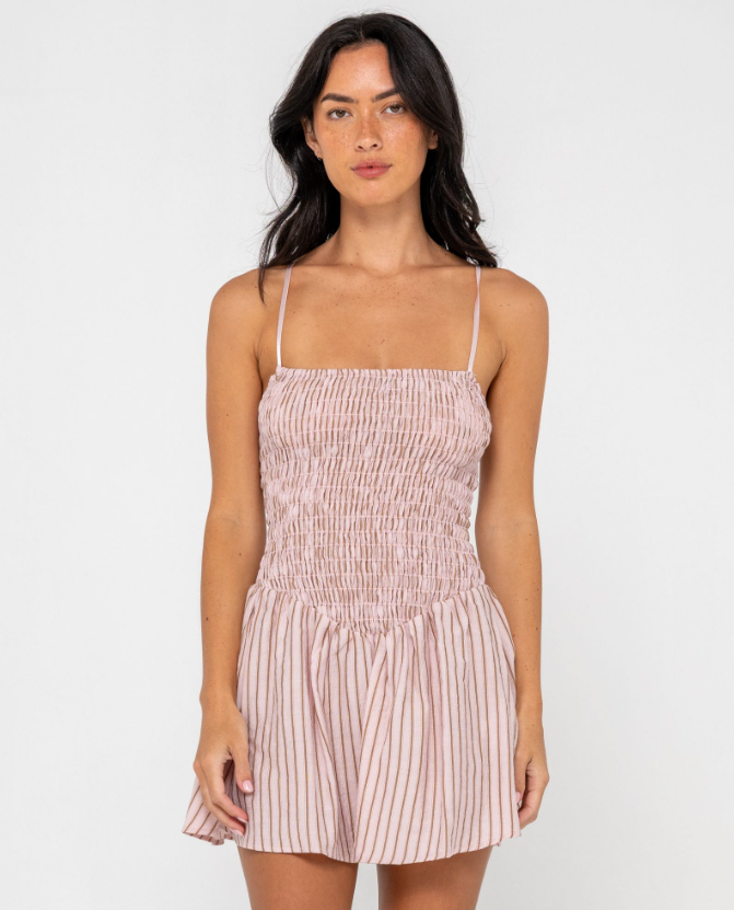 Rusty Mimi Smocked Stripe Mini Dress in pink stripe on model from front