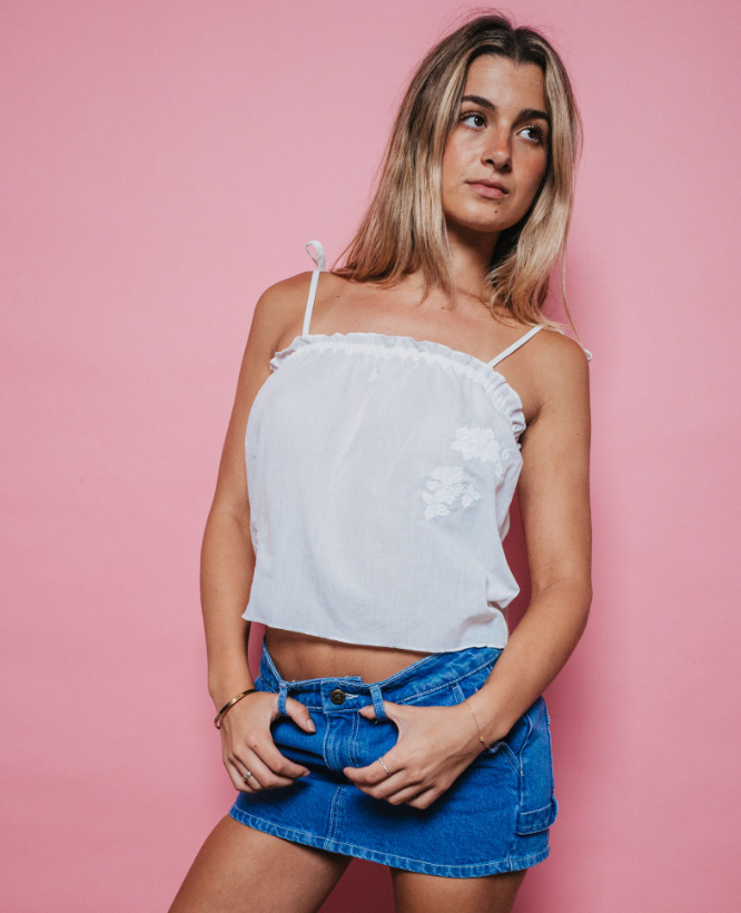 Rusty Feyre Cami Top in white on blonde woman in denim skirt