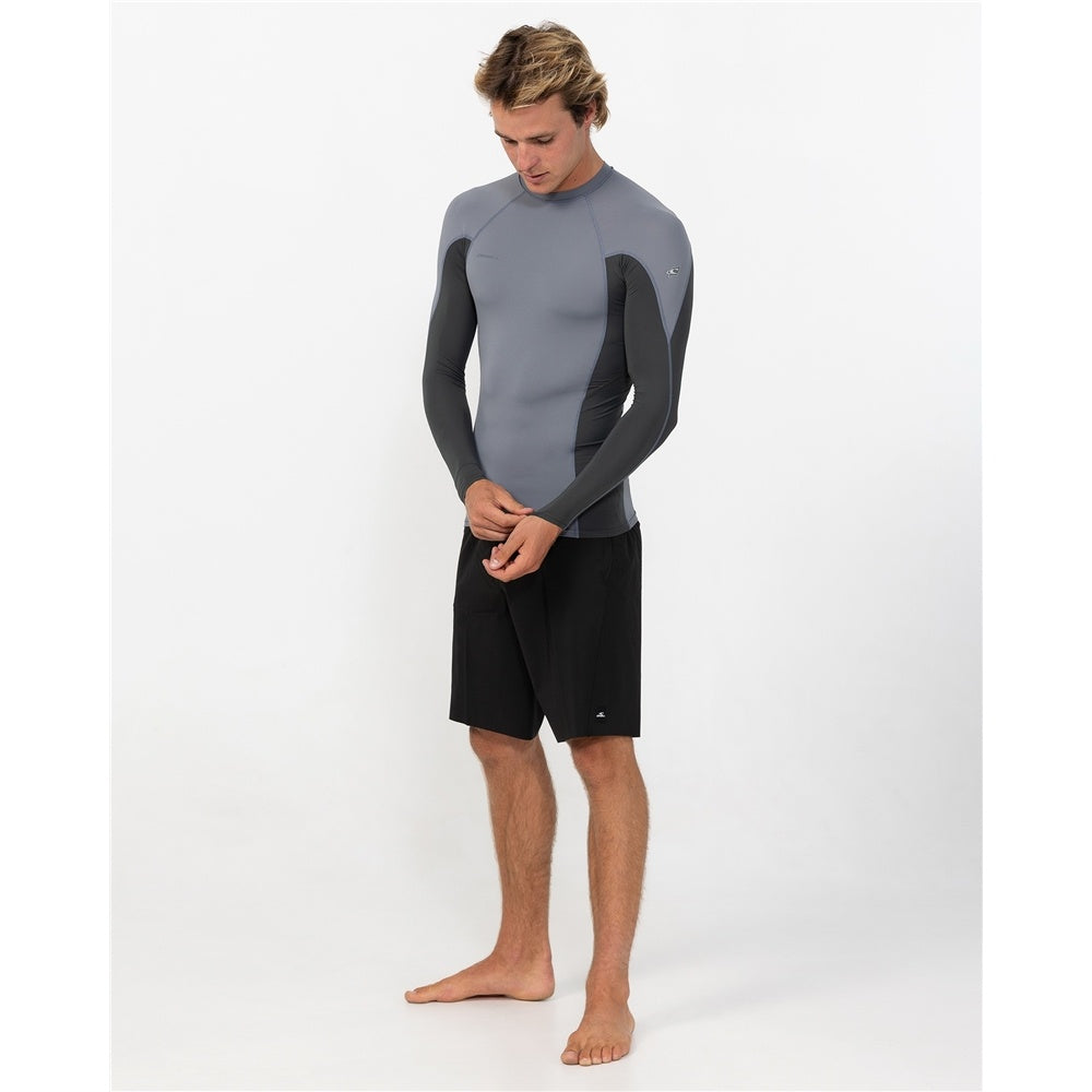 O'Neill Hyperfreak Skins Long Sleeve Rash Guard in dark shadow colourway on model in black boardshorts