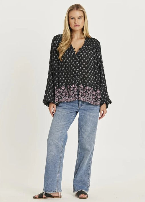 Amuse Society Mantra Long Sleeve Woven Shirt  in black on model in blue jeans from front