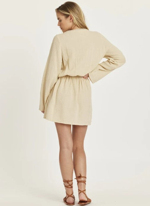 Amuse Society Ring My Bell Woven Mini Dress in sandy colourway on blonde model from rear
