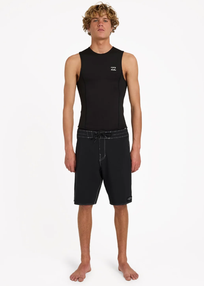 Billabong 1mm Absolute Core Men's Wetsuit Vest in black on model in black Billabong boardshorts from front