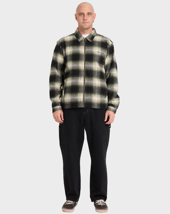 Billabong Bad Dog Jacket in black on model in black jeans from front