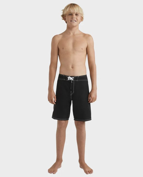Billabong Boys Script OG 18" Boardshorts  in black with white contrast detail on blond model from front