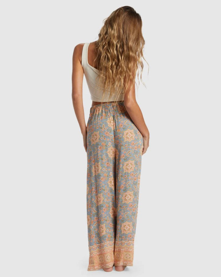 Billabong Follow Me 2 Pants in western sky floral colourway on model showing rear view