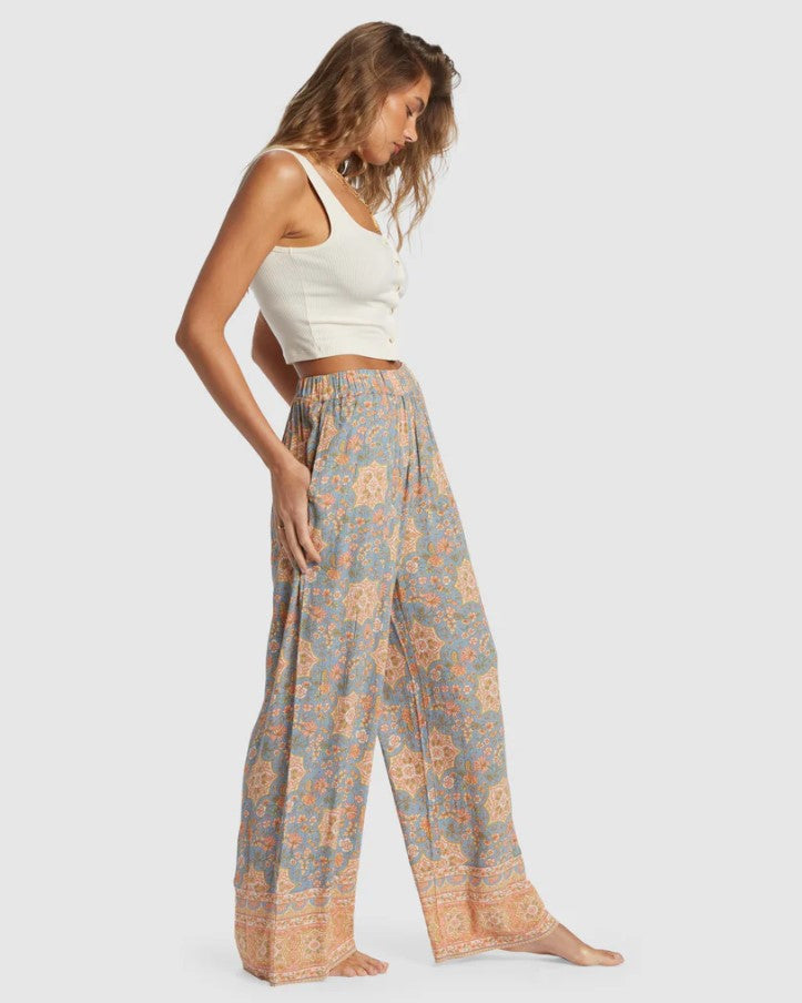 Billabong Follow Me 2 Pants in western sky floral colourway on model showing side view