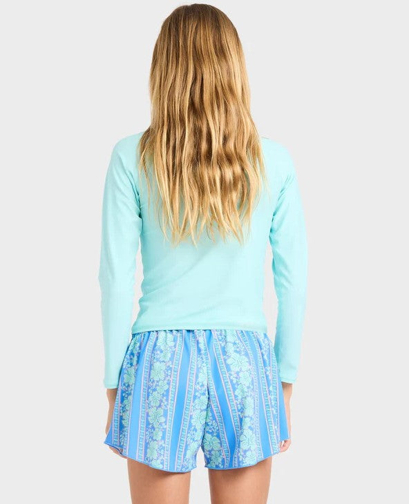 Billabong Happy Hibiscus Swim Volley Shorts  in blue multi on youth model wearing blue rash top from rear