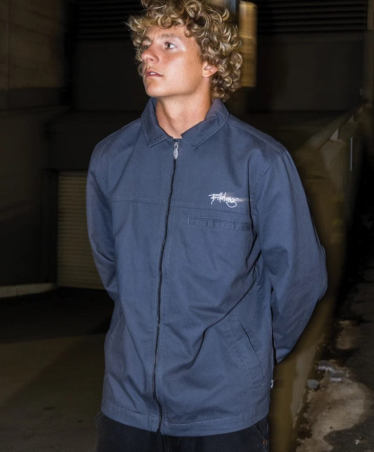 Billabong Jimmy Jacket in graphite indigo on model in warehouse