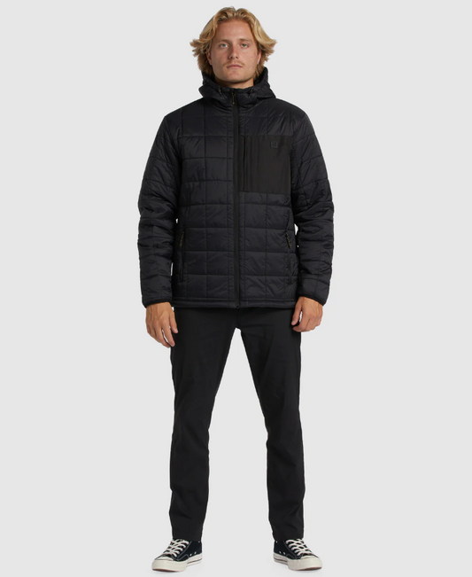 Billabong Journey Puffer Jacket in black on model in black pants from front