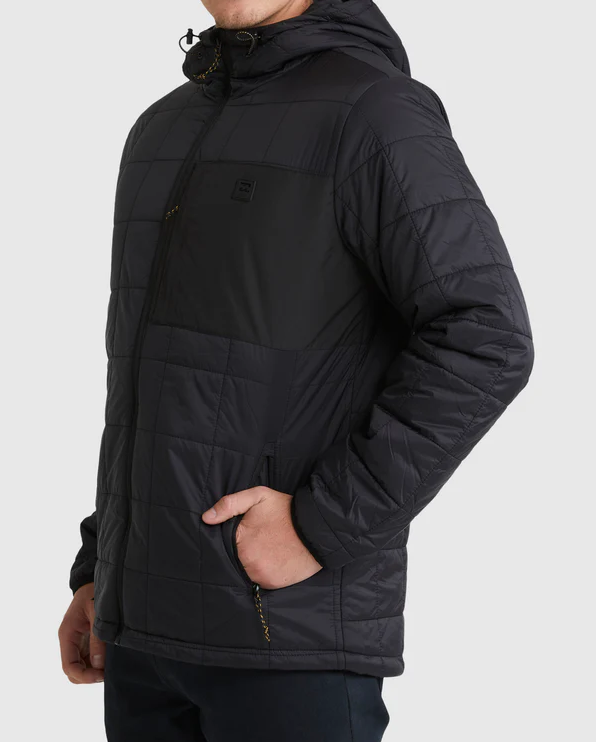 Billabong Journey Puffer Jacket in black on model from side