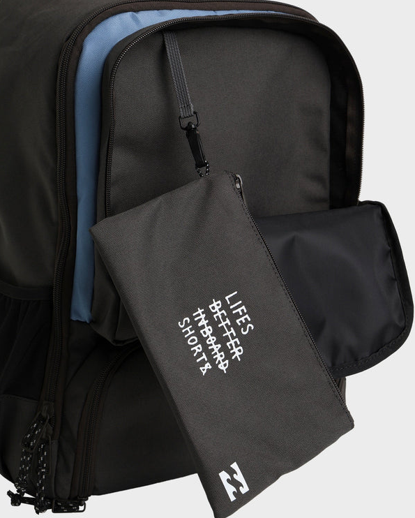 Billabong Juggernaught 30 Litre Backpack in raven colourway from front/side view showing open pocket with pencil case