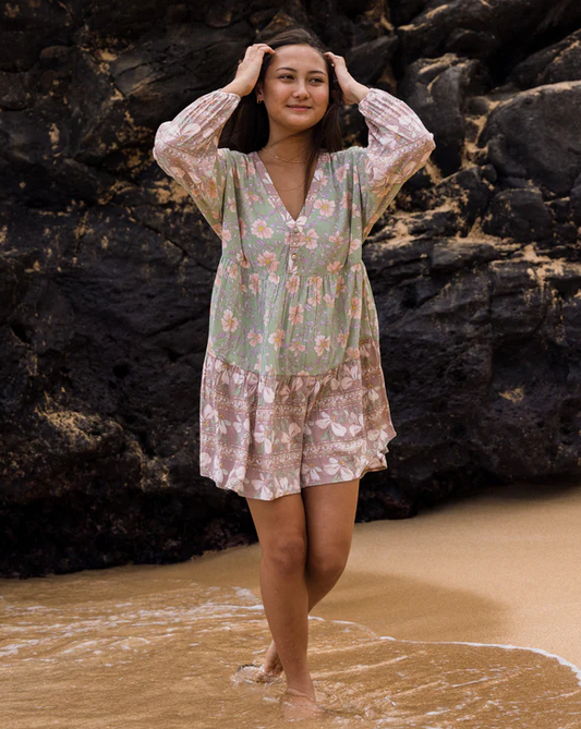 Billabong More To Sea La Mer Dress in pistachio colourway on model at beach