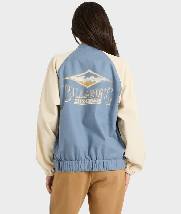 Billabong OG Burleigh Women's Jacket in stone blue with off white arms on model from rear showing large back Billabong logo